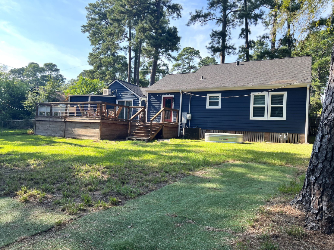 Back View of Home. Elevated South Facing Deck, Large Shady Back Yard, Fenced.