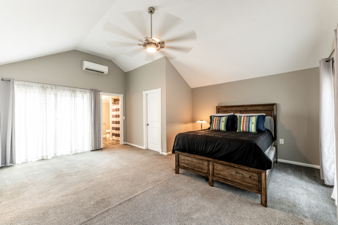 Primary Bedroom. Private Bath/Shower. Cool Ceiling Fan Doors to Deck.