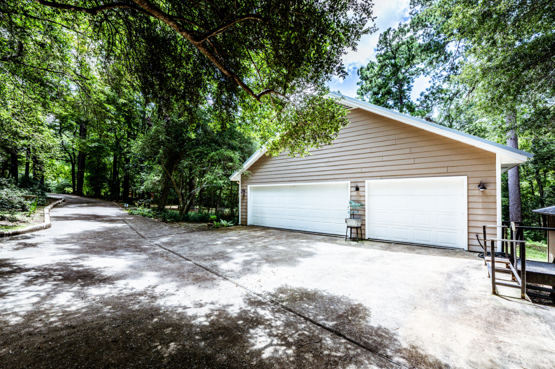 Double & single car garages. Paved/curb entry driveway.