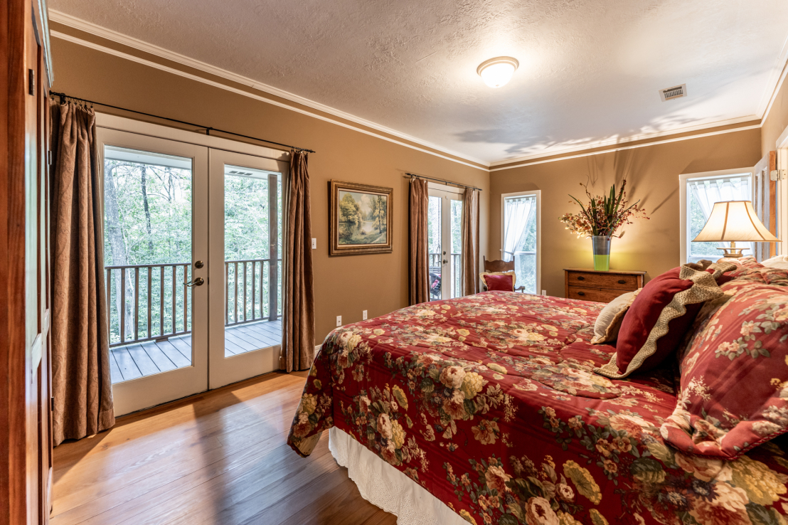 Primary Bedroom. Covered Porch with Swing